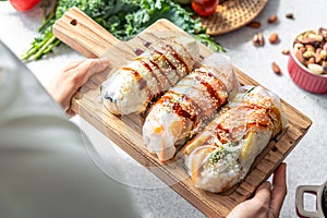 Group of spring rolls with rice paper filled with vegetables.