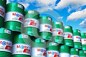 Group of stacked barrels with motor oil lubricant against blue s
