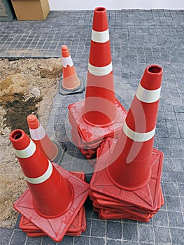 Group of Stacked Orange Traffic Road Cones
