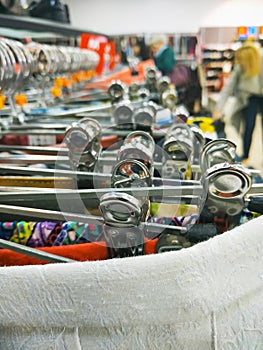 Group of stainless steel cloth hangers with cloth