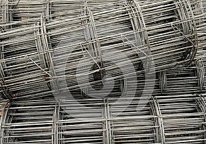 Group of steel structures roll square net on soil.  Prepare for construction site for reinforce concrete. iron pattern multiline i