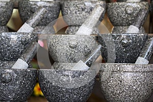 The group of Stone mortar and pestle for sale at local market. Chonburi Province.