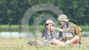 Group student asian young women and girl traveler with backpack adventure drinking water for relax.