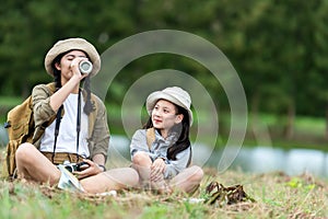 Group student asian young women and girl traveler with backpack adventure drinking water for relax.