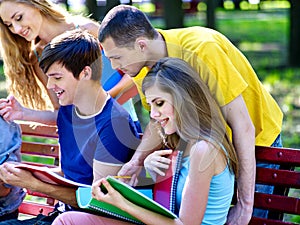 Group student with notebook on bench outdoor