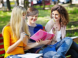 Group student with notebook outdoor.