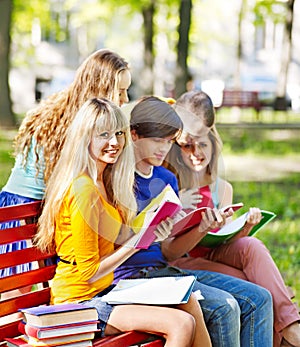 Group student with notebook outdoor.