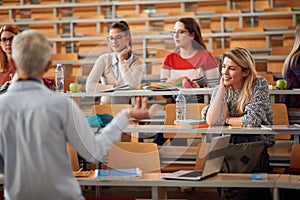 Group of students listening lecture