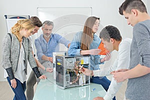 Group students around dismantled computer