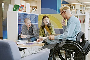Group of Students Collaborating in Modern Library