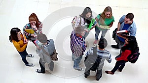 Group of students chatting in the hallway