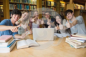 Group of students giving thumbs up
