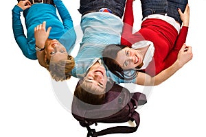 Group of students having fun, laying on white
