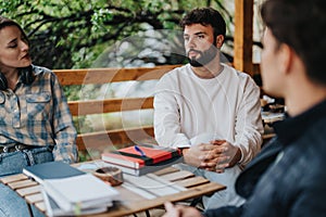 Group of students engaging in outdoor study session