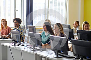 Group of students at an informatics lecture. Smart young people study at the college. Education, college, university, learning and
