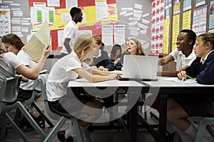 Group of students learning in classroom