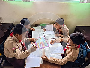 A group of students are learning to recognize and translate the Javanese script in class.