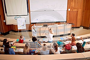 Group of students listening to lecturer in the classroom