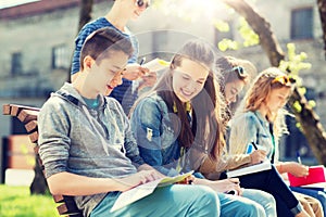 Group of students with notebooks at school yard