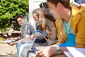 Group of students with notebooks at school yard