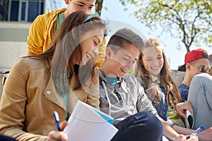 Group of students with notebooks at school yard