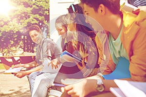 Group of students with notebooks at school yard