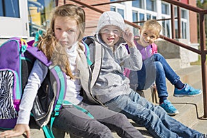 Students outside school standing together