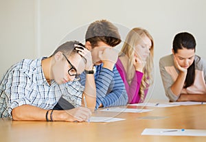 Group of students with papers