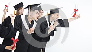 Group of Students Running and Celebrating Graduation