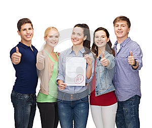 Group of students showing test and thumbs up