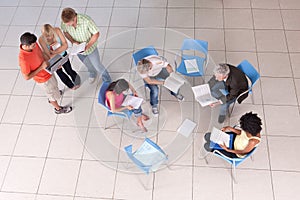 Group of students sitting down with lecturer photo