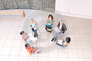 Group of students sitting down with lecturer photo