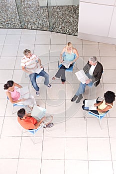 Group of students sitting down with lecturer photo