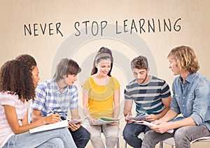 Group of students sitting in front of Never Stop Learning text