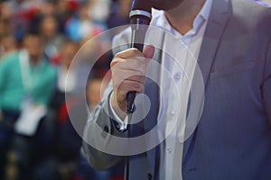 Group of students study with professor in modern big school classroom
