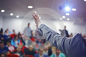 Group of students study with professor in modern big school classroom