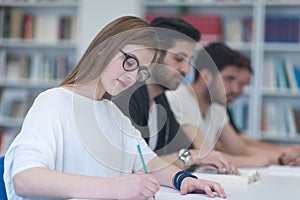 Group of students study together in classroom