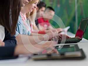 Group of students study together in classroom