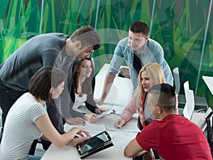 Group of students study together in classroom