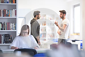 Group of students study together in classroom