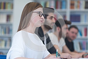 Group of students study together in classroom