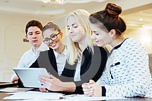 Group of students studying using a laptop