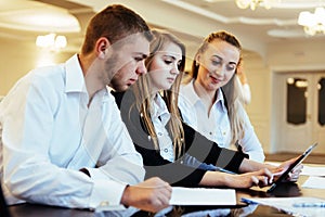 Group of students studying using a laptop