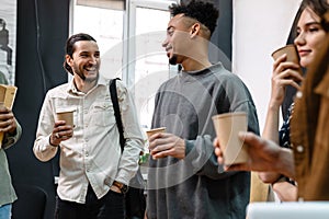Group of students talking while having a coffee break