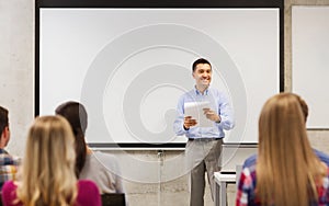 Group of students and teacher with notepad