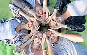 Group of students or teenagers lying in circle