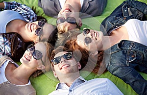 Group of students or teenagers lying in circle