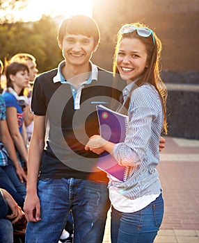 Group of students or teenagers with notebooks