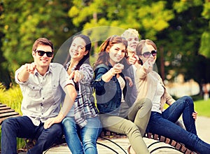 Group of students or teenagers pointing fingers