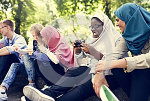 Group of students using mobile phone